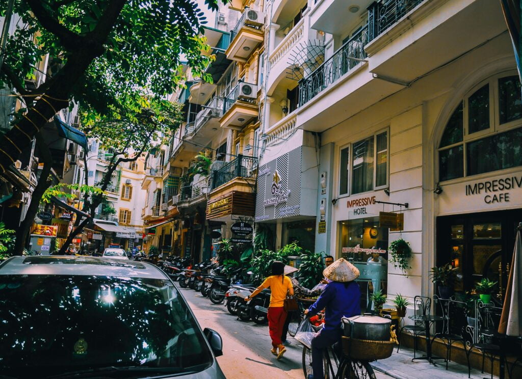 People Walking in Front of Buildings