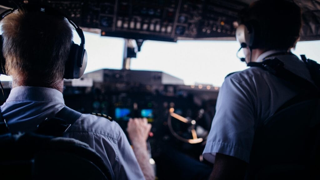 a group of men in a cockpit